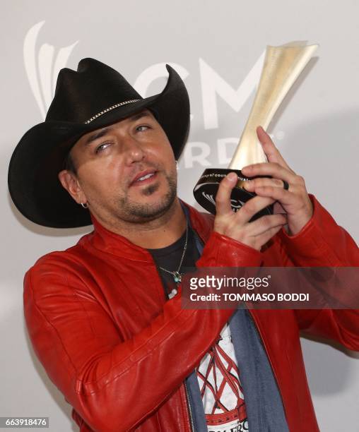 Jason Aldean poses with the Entertainer of the Year award in the press room of the 52nd Academy of Country Music Awards on April 2 at the T-Mobile...