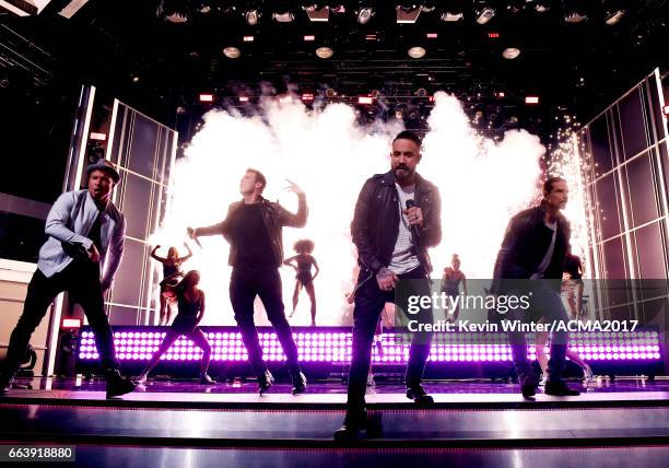 Singers Brian Littrell, Nick Carter, AJ McLean and Kevin Richardson of Backstreet Boys perform onstage during the 52nd Academy of Country Music...