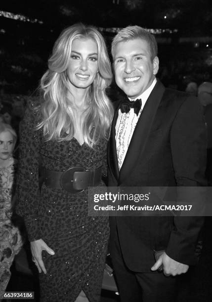 Music artist Faith Hill and reality TV star Todd Chrisley attend the 52nd Academy Of Country Music Awards at T-Mobile Arena on April 2, 2017 in Las...