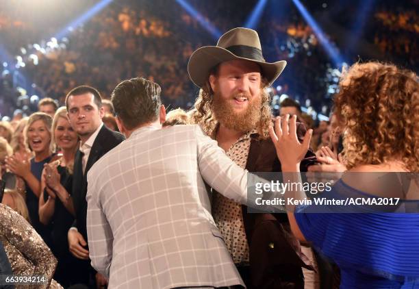 Singers T.J. Osborne and John Osborne of Brothers Osborne win award during the 52nd Academy Of Country Music Awards at T-Mobile Arena on April 2,...