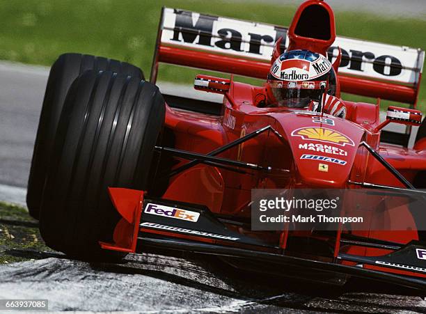 Michael Schumacher of Germany drives the Scuderia Ferrari Marlboro Ferrari F399 Ferrari V10 during the San Marino Grand Prix on 2 May 1999 at the...