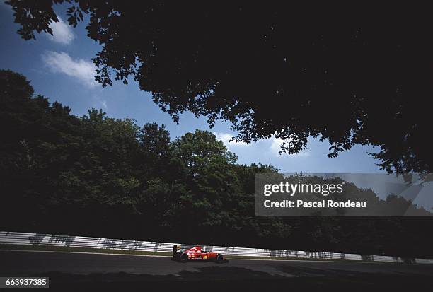 Ivan Capelli of Italy drives the Scuderia Ferrari SpA Ferrari F92A along the tree lined forest section of the circuit during the Mobil 1 German Grand...