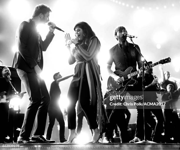 Editor's note: This image was converted to black and white.] Singers Charles Kelley, Hillary Scott and Dave Haywood of Lady Antebellum perform...