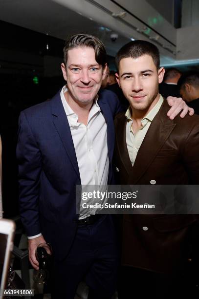 Eddie Roche and Nick Jonas attend The Daily Front Row and REVOLVE FLA after party at Mr. Chow hosted by Mert Alas on April 2, 2017 in Los Angeles,...