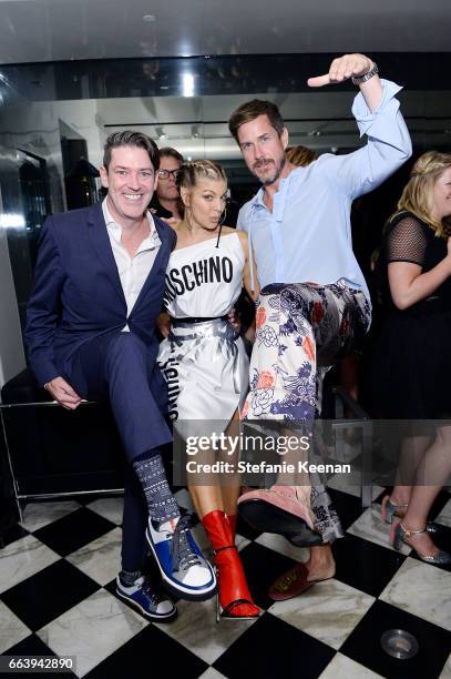 Eddie Roche, Fergie and Mark Tevis attend The Daily Front Row and REVOLVE FLA after party at Mr. Chow hosted by Mert Alas on April 2, 2017 in Los...
