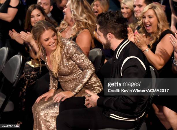 Lauren Gregory and singer-songwriter Thomas Rhett react during the 52nd Academy Of Country Music Awards at T-Mobile Arena on April 2, 2017 in Las...