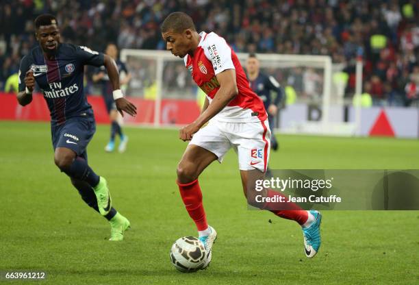 Kylian Mbappe of Monaco and Serge Aurier of PSG during the French League Cup final between Paris Saint-Germain and AS Monaco at Parc OL on April 1,...