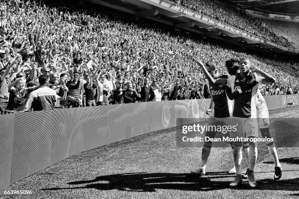 David Neres of Ajax celebrates scoring his teams second goal of the game with team mates Joel Veltman and Bertrand Traore during the Dutch Eredivisie...