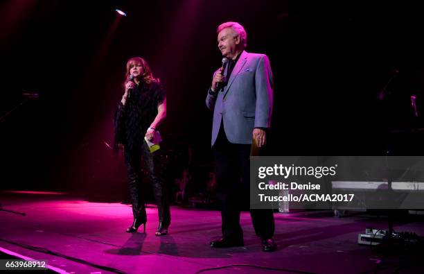 Radio personalitites Lorianne Crook and Charlie Chase speak onstage the ACM Awards official after party at The Joint inside the Hard Rock Hotel &...