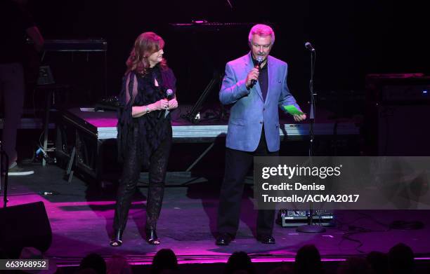Radio personalitites Lorianne Crook and Charlie Chase speak onstage the ACM Awards official after party at The Joint inside the Hard Rock Hotel &...