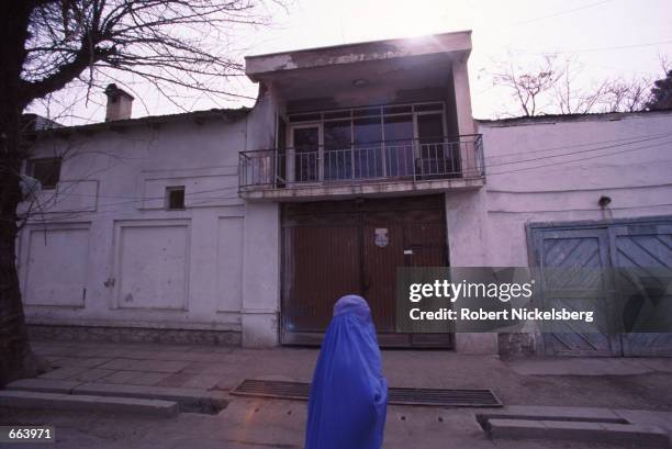 Woman, heavily shrouded in the traditional "burqa" walks past the Chechen embassy March 5, 2000 in Kabul Afghanistan. The Taliban has supported the...