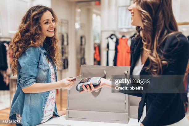 fast and comfortable shopping - clothes shop counter stock pictures, royalty-free photos & images