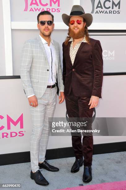 Recording artists T.J. Osborne and John Osborne of music group Brothers Osborne arrive at the 52nd Academy Of Country Music Awards on April 2, 2017...