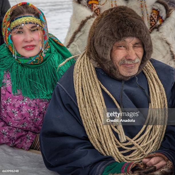 People watch the races on the Reindeer Herders' Day celebration in the city of Aksarka, in Yamal-Nenets Region, 2500 kilometres northeast of Moscow,...