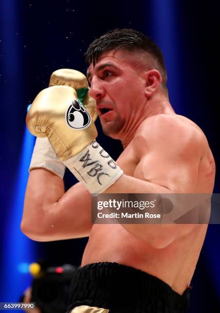 Marco Huck of Germany in action against Mairis Briedis of Latvia during their WBC Cruiserweight World Championship title fight at Westfalenhalle on...