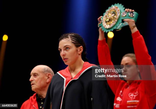 Christina Hammer of Germany poses with coach Dimitros Kirnos before the WBC middleweight World Championship title fight at Westfalenhalle on April 1,...