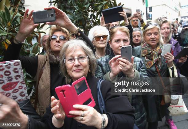 Members of the public are seen as Prince Charles, Prince of Wales and Camilla, Duchess of Cornwall visit Sant'Ambrogio Market to celebrate the Slow...