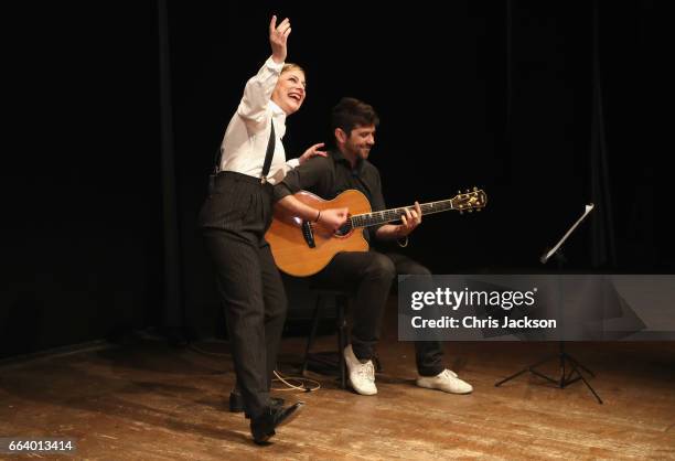 Musicians peform for Prince Charles, Prince of Wales and Camilla, Duchess of Cornwall during their visit to Sant'Ambrogio Market to celebrate the...