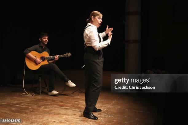 Musicians peform for Prince Charles, Prince of Wales and Camilla, Duchess of Cornwall during their visit to Sant'Ambrogio Market to celebrate the...