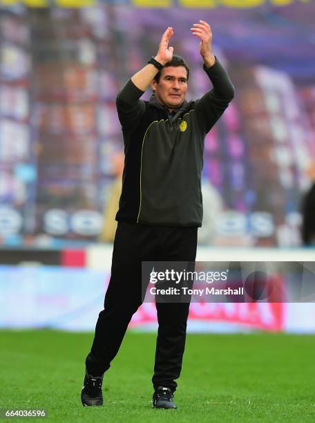 Nigel Clough, Manager of Burton Albion applauds the fans at the end of the match during the Sky Bet Championship match between Huddersfield Town and...