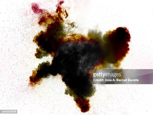 explosion of a cloud of powder of particles of  colors red and grey on a white background - partícula stock-fotos und bilder