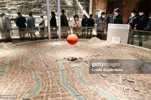 Visitors look at an exhibit inside the Hiroshima Peace Memorial Museum in the western Japanese city of Hiroshima in this file photo taken Feb. 24,...