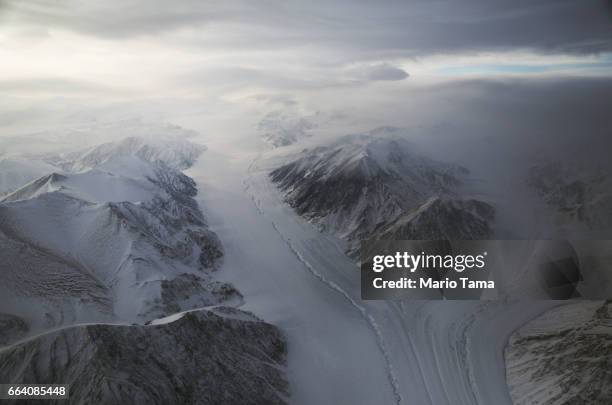 Section of a glacier is seen from NASA's Operation IceBridge research aircraft on March 29, 2017 above Ellesmere Island, Canada. The ice fields of...
