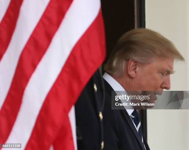 President Donald Trump walks out to greet Egyptian President Abdel Fattah Al Sisi upon his arrival at the West Wing of the White House on April 3,...