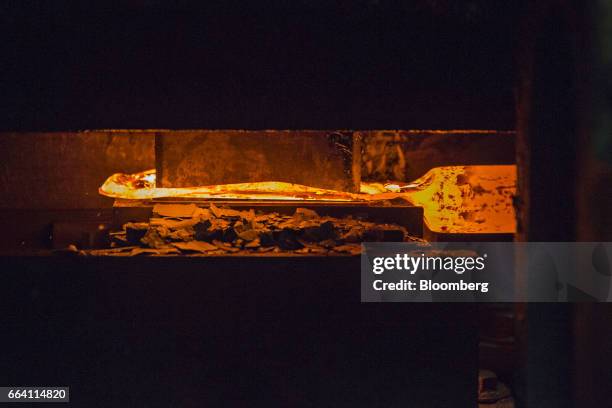 Drop hammer presses a mold over a metal billet as a Blacksmith hammer is forged at the Vaughan & Bushnell Manufacturing Co. Facility in Bushnell,...