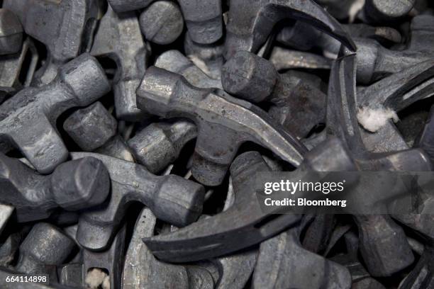 Forged steel hammer heads sit in a bin at the Vaughan & Bushnell Manufacturing Co. Facility in Bushnell, Illinois, U.S., on Friday, March 31, 2017....