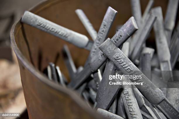 Forged steel hammer handles sit in a bin at the Vaughan & Bushnell Manufacturing Co. Facility in Bushnell, Illinois, U.S., on Friday, March 31, 2017....