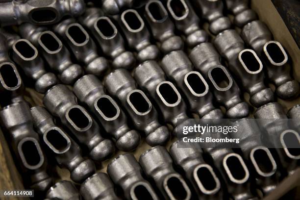 Forged steel ball pein hammer heads sit in a bin at the Vaughan & Bushnell Manufacturing Co. Facility in Bushnell, Illinois, U.S., on Friday, March...