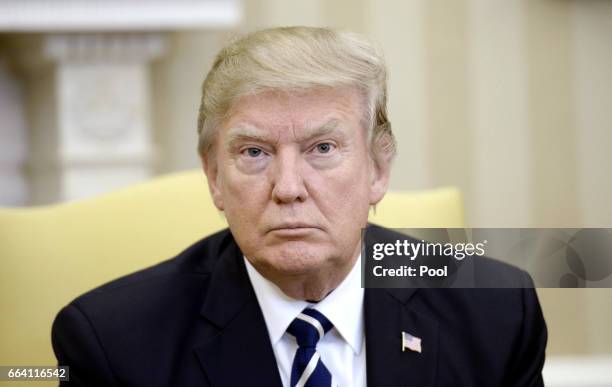 President Donald Trump looks on as he meets with Egyptian President Abdel Fattah Al Sisi in the Oval Office of the White House on April 3, 2017 in...