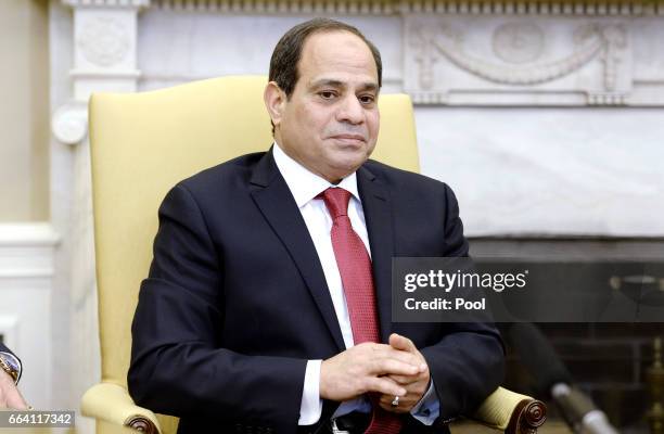 Egyptian President Abdel Fattah Al Sisi looks on as he meets with U.S. President Donald Trump in the Oval Office of the White House on April 3, 2017...