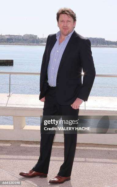 British chef James Martin, who stars in the series ''James Martin's French Adventure", poses during a photocall as part of the MIPTV event on April...