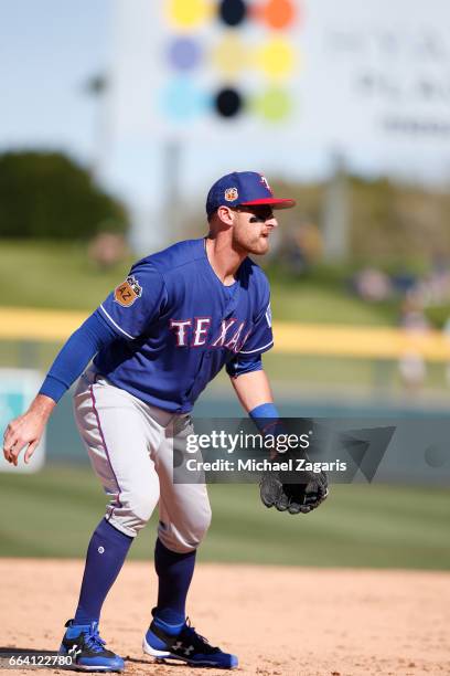 Will Middlebrooks of the Texas Rangers fields during the game against the Oakland Athletics at Hohokam Stadium on March 2, 2017 in Mesa, Arizona.