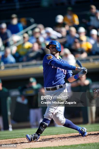 Will Middlebrooks of the Texas Rangers bats during the game against the Oakland Athletics at Hohokam Stadium on March 2, 2017 in Mesa, Arizona.