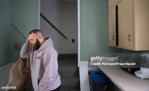 Paul Troverello talks on a cell phone on February 11, 2017 in the kitchen at the Arise addiction recovery program house in Machias. Troverello is the...
