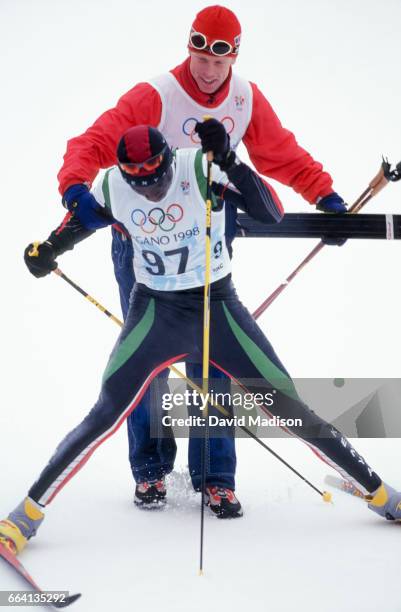 Philip Boit of Kenya completes the Men's 10 Kilometer Classical event of the Nordic Skiing competition at the 1998 Winter Olympics held on February...