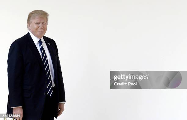 President Donald Trump leaves the Oval Office of White House to walk to the Residence on April 3, 2017 in Washington, DC. President Trump and...