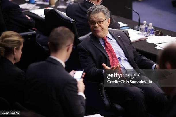 Senate Judiciary Committee member Sen. Al Franken talks with staff during an executive business meeting to debate and vote on Supreme Court nominee...