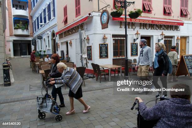 Woman uses a walker in the street on April 3, 2017 in Gibraltar. Tensions have risen over Brexit negotiations for the Rock of Gibraltar. The European...