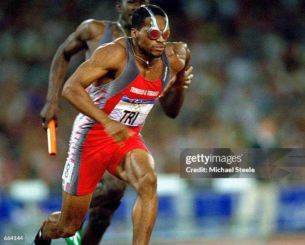 Ato Boldon of Trinidad and Tobago wears Oakley sunglasses September 29, 2000 during the men's 4x100m relay semi-finals at the Olympic Stadium on day...