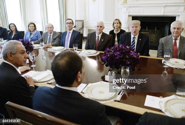 President Donald Trump flanked by Secretary of State Rex Tillerson and Vice President Mike Pence speaks as President Abdel Fattah Al Sisi of Egypt...