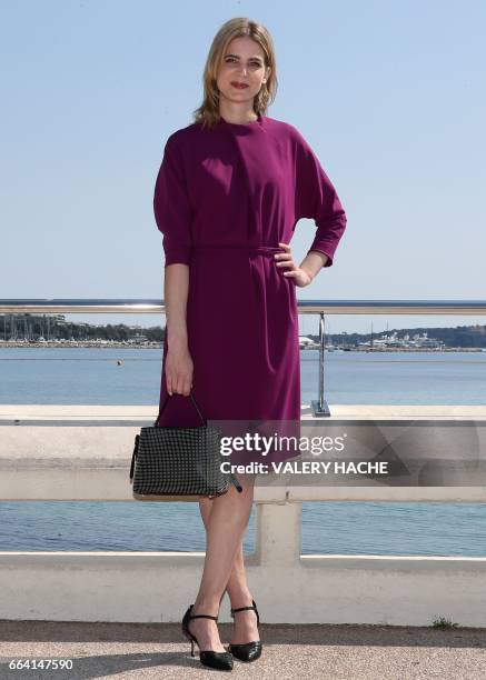 German actress Rike Schmid, who stars in the series 'Maltese', poses during a photocall as part of the MIPTV event on April 3, 2017 in Cannes,...