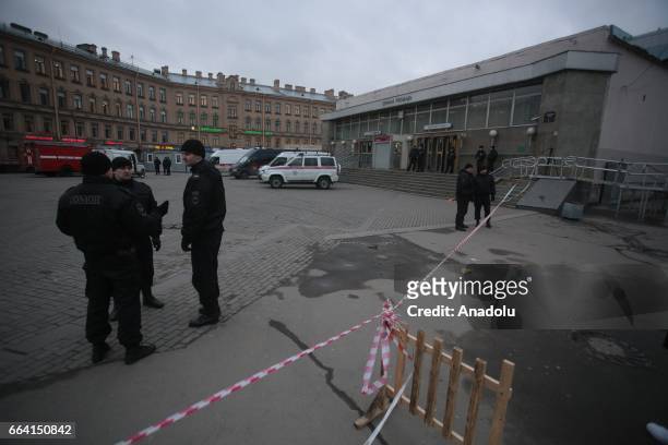 Police officers take security measures near the area after an explosion at a subway station in St Petersburg, Russia on April 3, 2017. A blast hit a...