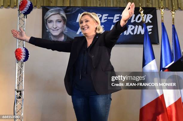 French far-right Front National party candidate for the presidential election Marine Le Pen gestures during a rally in La Bazoche-Gouet on April 3,...