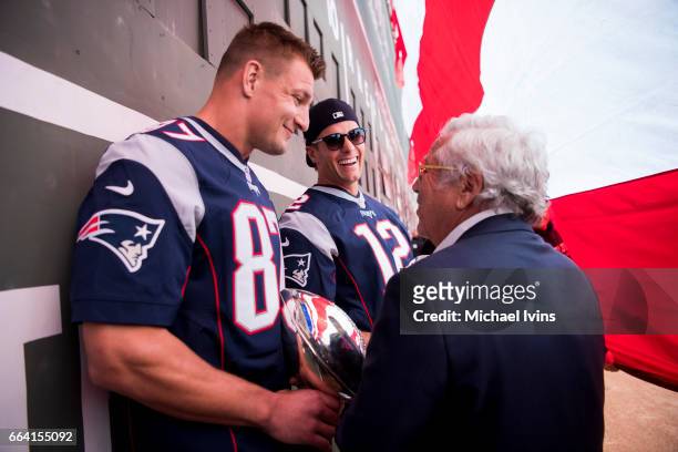 Rob Gronkowski, Tom Brady and owner Robert Kraft of the New England Patriots wait to be introduced during a ceremony in recognition of their Super...