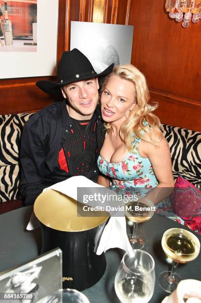 Luke Gilford and Pamela Anderson attend the launch of the Coco De Mer Icons Collection at Albert's Club on April 3, 2017 in London, England.