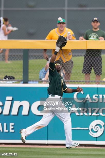 Alejandro De Aza of the Oakland Athletics fields during the game against the San Francisco Giants at Hohokam Stadium on March 3, 2017 in Mesa,...